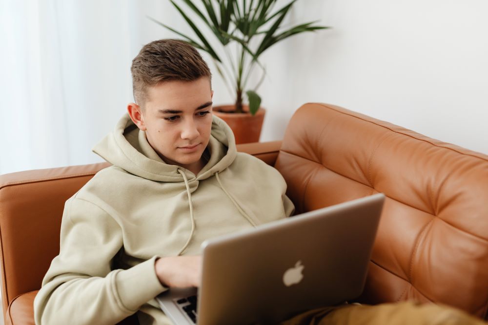 young man at a laptop